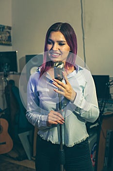 Pretty Girl Singing Into Studio Microphone.