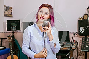 Pretty Girl Singing Into Studio Microphone.