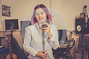 Pretty Girl Singing Into Studio Microphone.