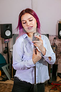 Pretty Girl Singing Into Studio Microphone.