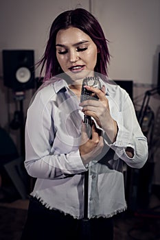 Pretty Girl Singing Into Studio Microphone.