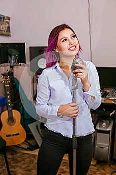 Pretty Girl Singing Into Studio Microphone.