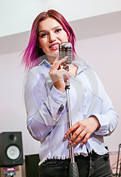 Pretty Girl Singing Into Studio Microphone.