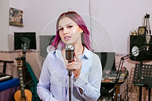 Pretty Girl Singing Into Studio Microphone.