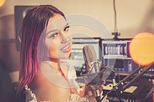 Pretty Girl Singing Into Studio Microphone.