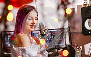 Pretty Girl Singing Into Studio Microphone.