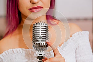 Pretty Girl Singing Into Studio Microphone.