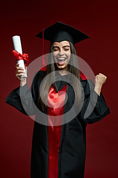 Pretty girl smiling, crying, holding diploma, showing hurray.