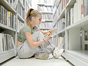 Pretty girl teenager in library