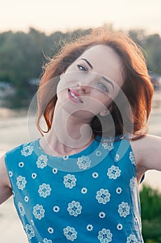 Pretty girl truly smiling, dancing, outdoors summer