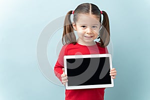 Pretty girl using technology in a studio