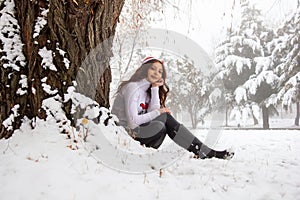 Pretty girl in winter forest, young woman in winter park