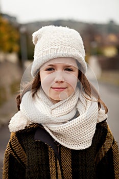 Pretty girl with wool hat in a park