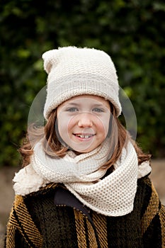 Pretty girl with wool hat in a park