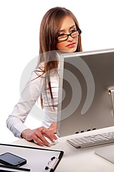 Pretty girl works on a computer