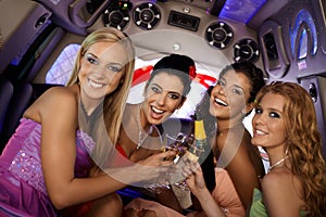 Pretty girls celebrating in limo