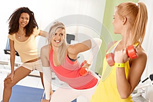 Pretty girls exercising with dumbbells