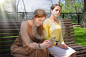 Pretty girls sitting on the bench