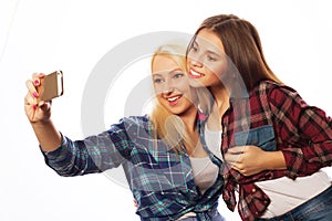 Pretty hipster girls taking selfie.