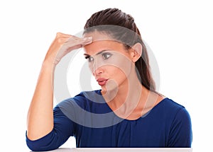 Pretty hispanic in blue blouse gesturing error