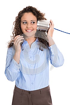 Pretty isolated young woman on the tin can phone: communication