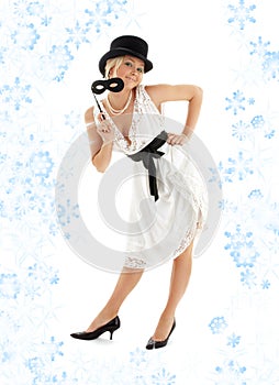 Pretty lady with black mask and snowflakes