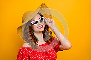 Pretty lady came pool party ready chill sun bathing wear red dress specs hat isolated yellow background