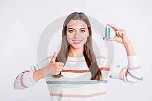 Pretty lady offering to use bronchospasm cartridge aerosol wear striped pullover isolated white background photo