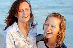 Pretty laughing teen faces at beach