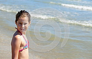 Pretty little girl with a bathing suit in summer