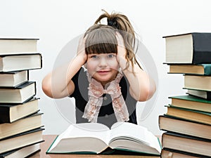 Pretty little girl with books