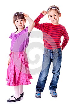 Pretty little girl and boy in studio