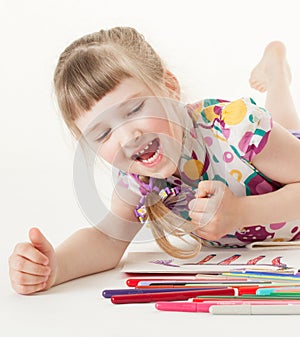 Pretty little girl choosing a felt-tip pen