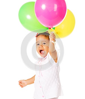 Pretty little girl with colorful balloons