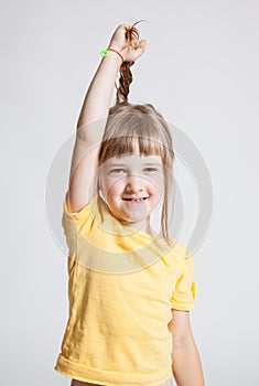 Pretty little girl demonstrating her beautiful long hair