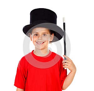 Pretty little girl doing magic with a top hat and a magic wand