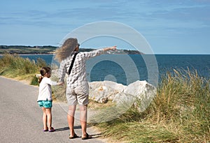 Pretty little girl and her mother on vacation in Wissant on the Opal Coast