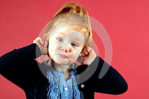 Pretty little girl making funny face