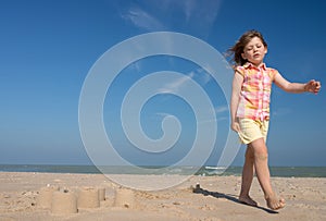 Pretty little girl making sandcastles on the beaches of Hauts-de-France