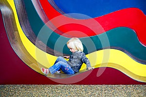 Pretty little girl playing in the Sculpt Illusion gallery, New Zealand.