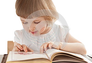 Pretty little girl reading an interesting book