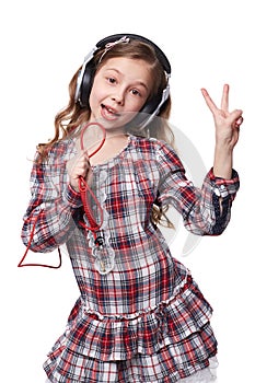 Pretty little girl singing in imaginary microphone