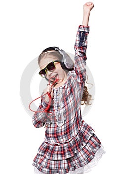 Pretty little girl singing in imaginary microphone