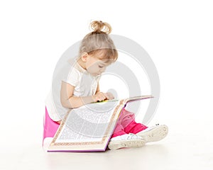 Pretty little girl sits on potty.