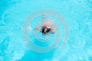 Pretty little girl in swimming pool