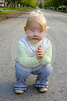 Pretty little girl walk in the park.