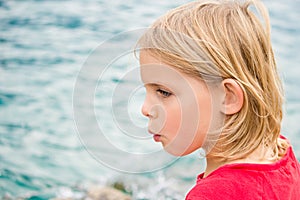 Pretty Little Girl Whistling by the Lake