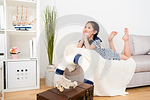 Pretty little kid girl lying down on sofa couch