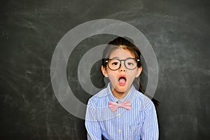 Pretty little teacher shocked looking at camera