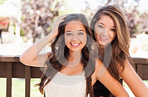 Pretty Mixed Race Teen Girlfriends Pose for Portrait Outdoors